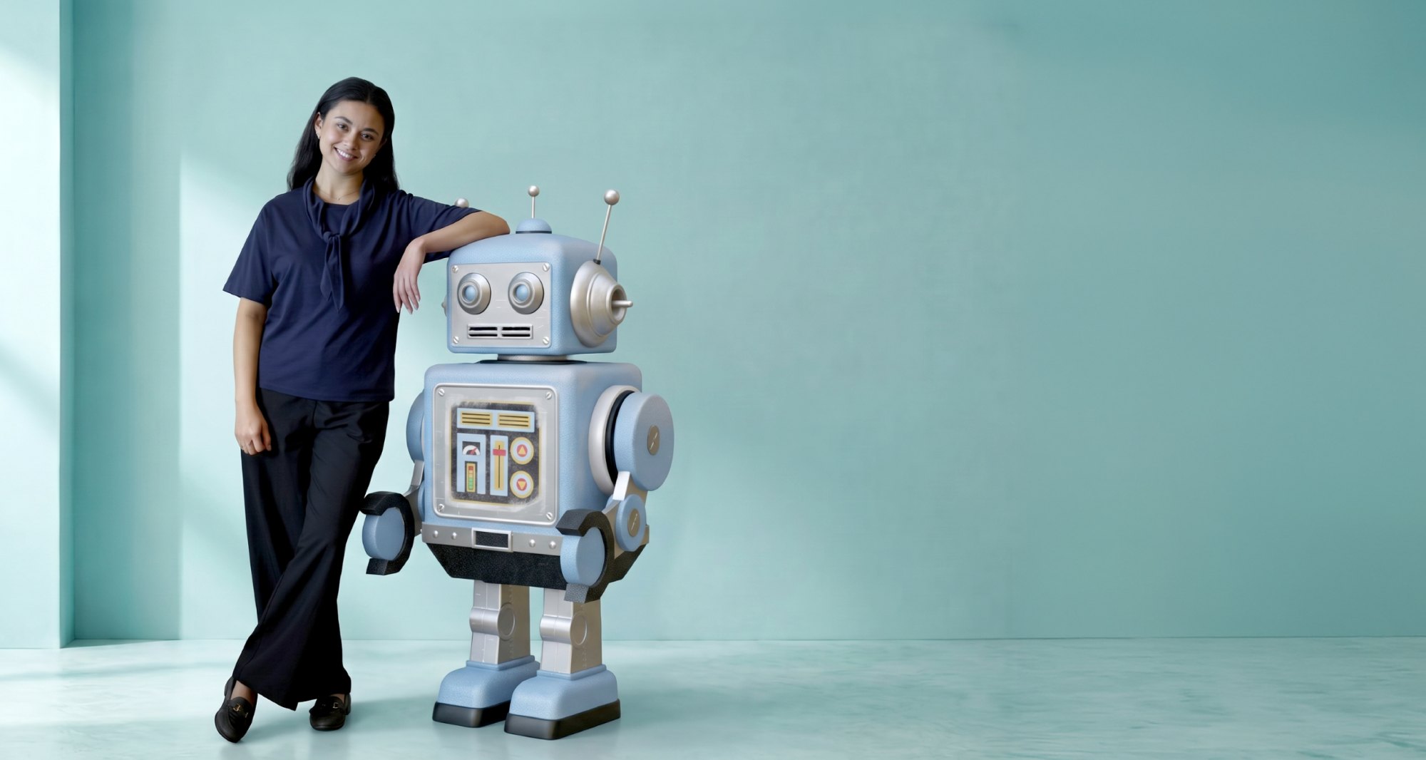 Woman standing next to a friendly retro robot