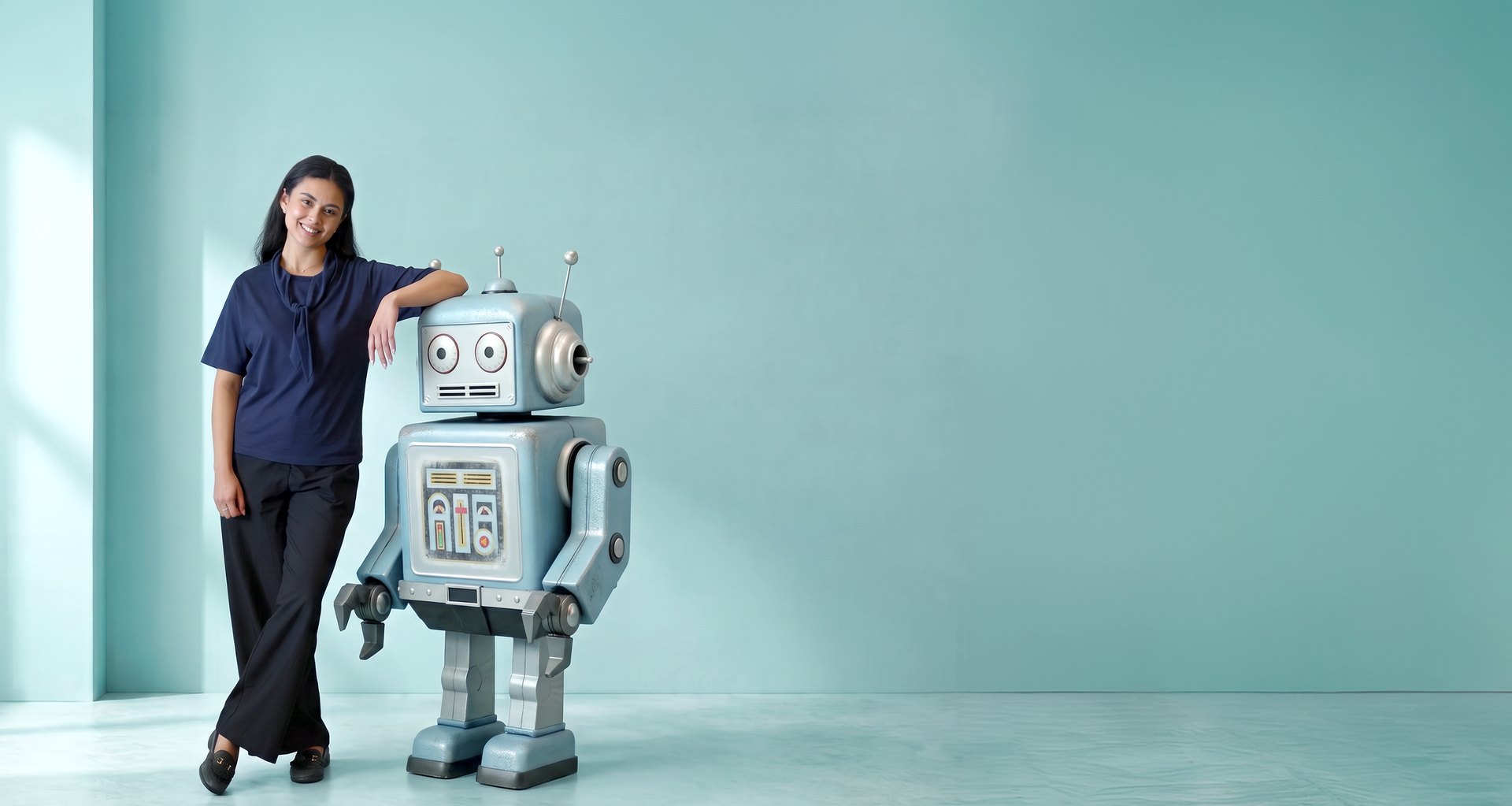 Woman standing next to a friendly retro robot